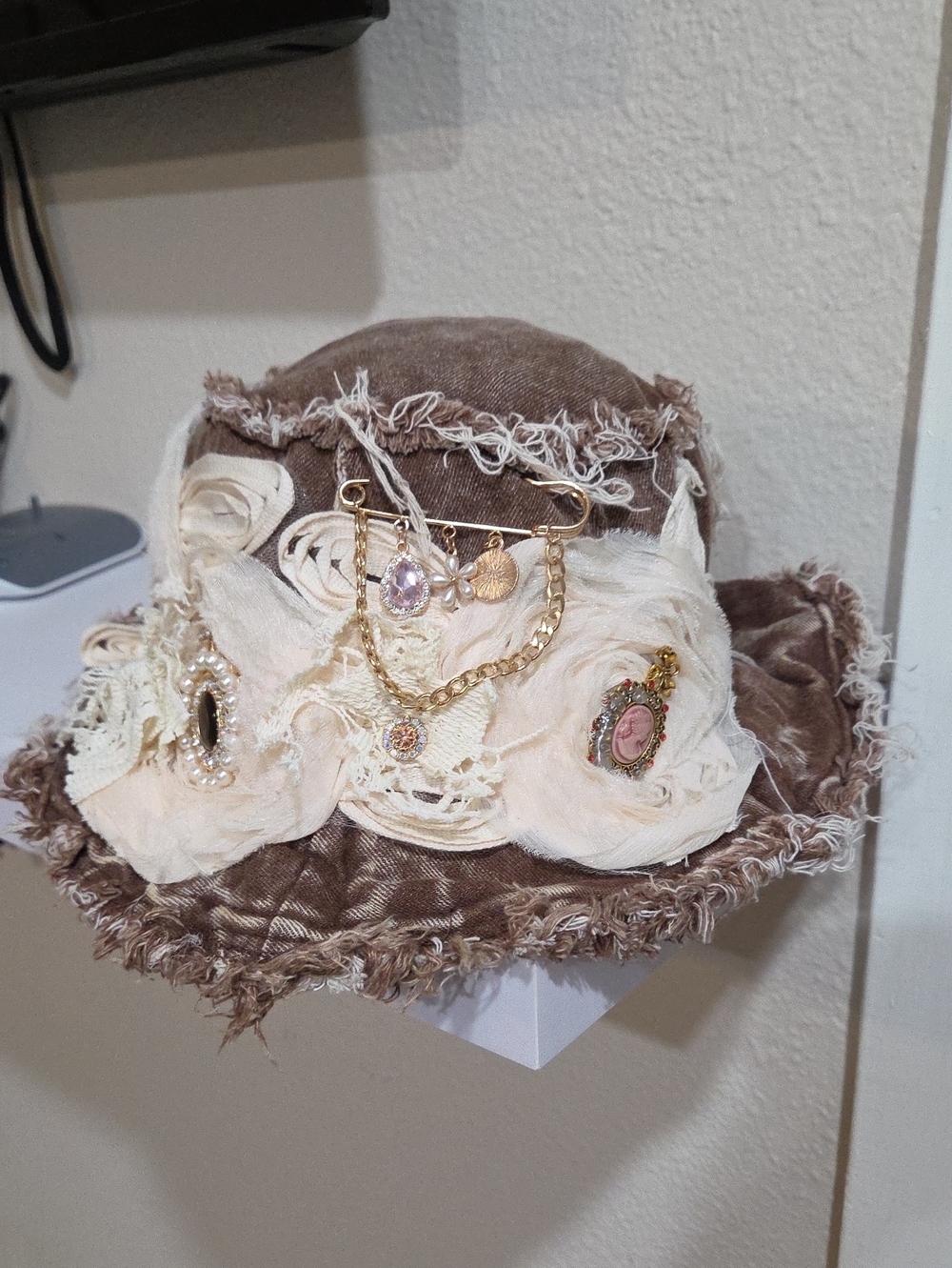 Brown Denim Women's Decorative Hat with Cream Floral Trim and Gold Accents